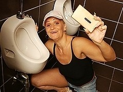 Horny mature slut gets pissed and fucked on a toilet